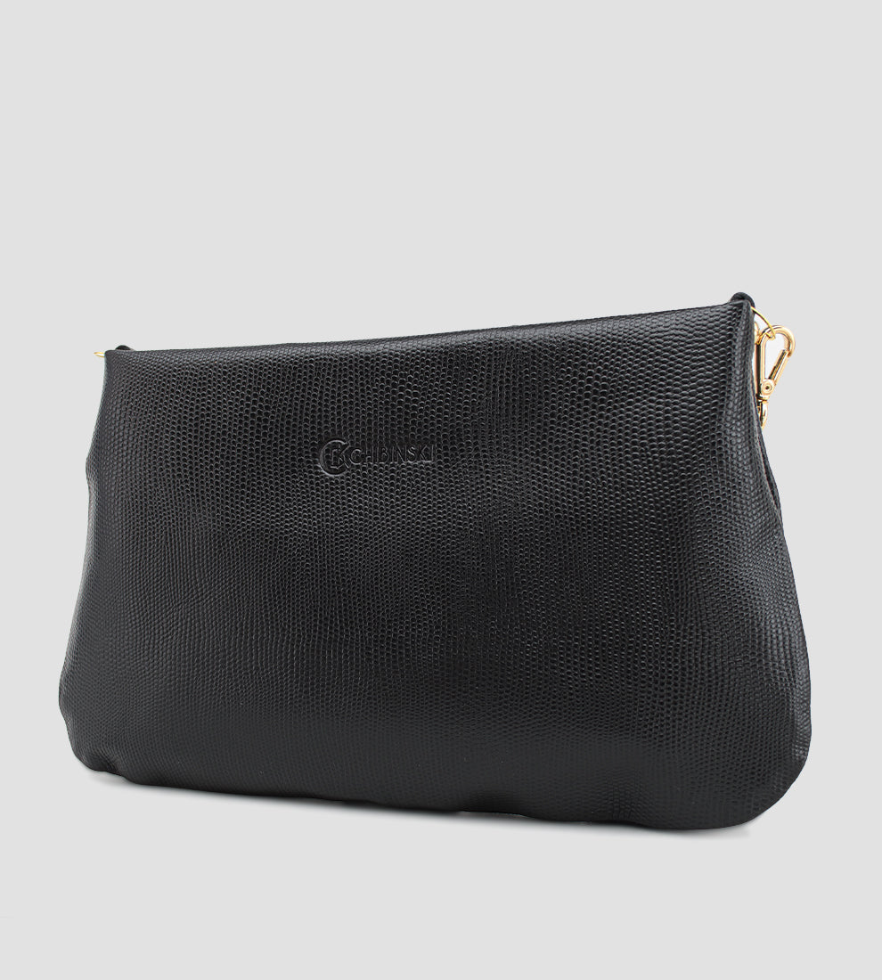 Bolsa feminina em couro preto com nó frontal, corrente dourada e alça ajustável removível.